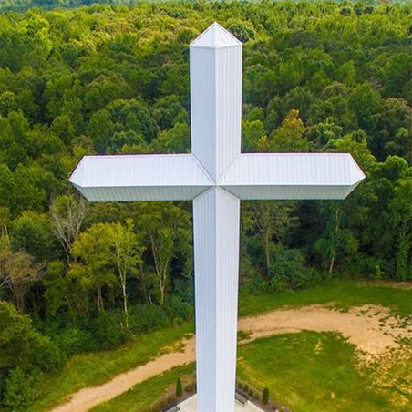 Large white cross shaped monument