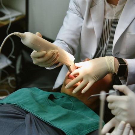 Dental patient having digital impressions taken of their teeth