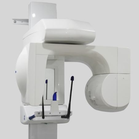 Large white C T cone beam scanning machine against white wall