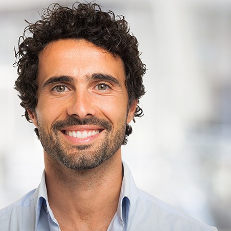 Patient in Grenada smiling with dental implants