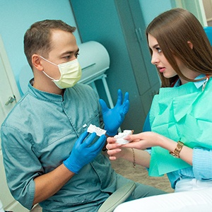 Patient in Grenada talking to dentist about dental implants