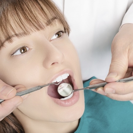 Woman receiving a dental checkup